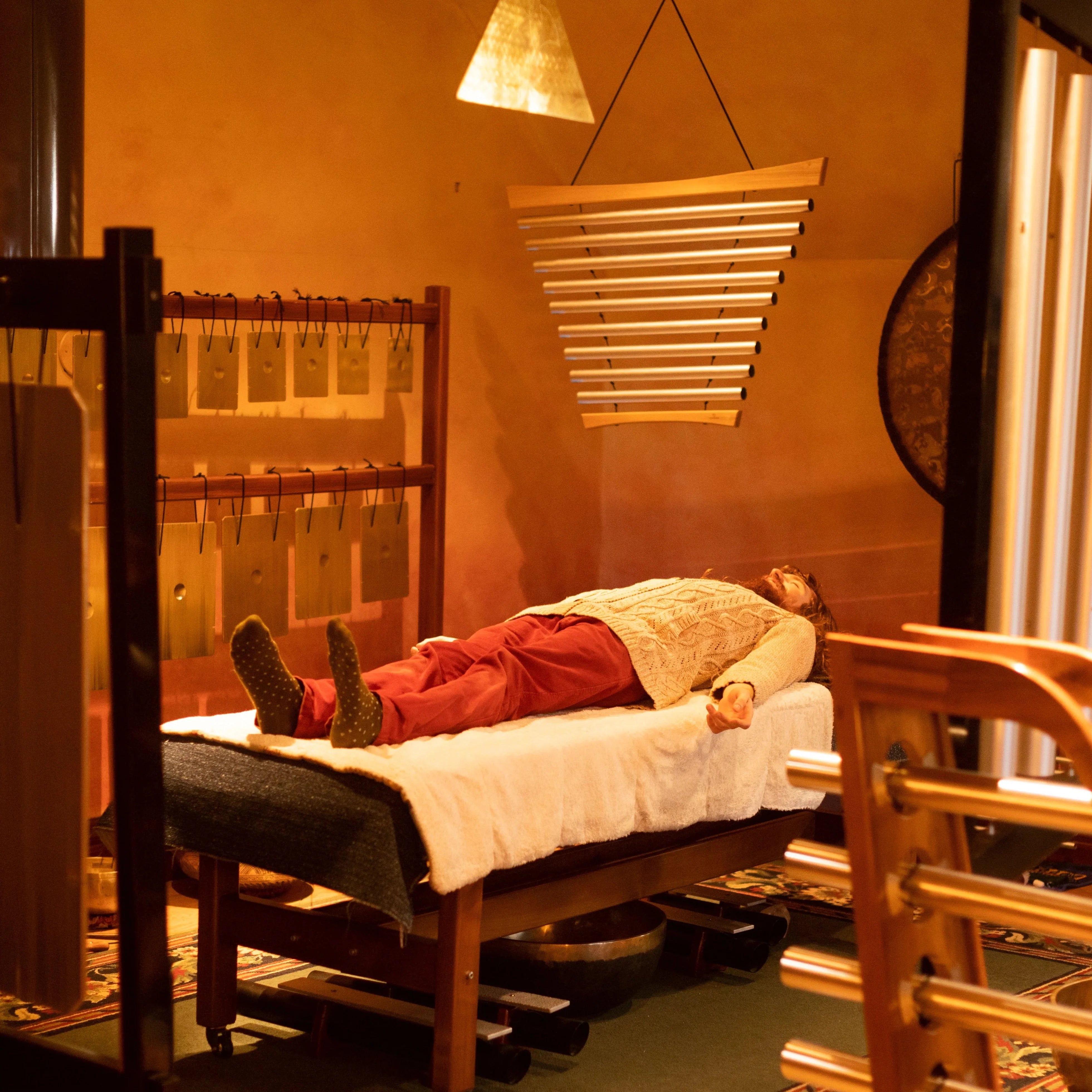 Sonorium sound healing treatment room featuring Svaram handcrafted resonating instruments from Auroville