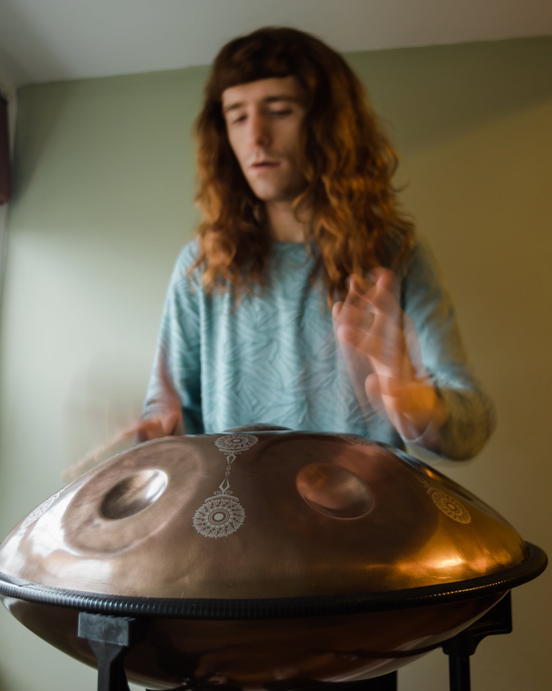 Hands playing a handcrafted sound healing instrument, handpan from a special collaboration